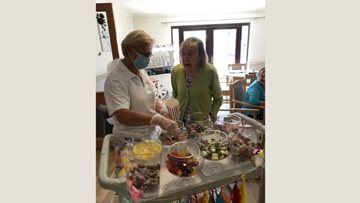 Lincoln care home colleague sets up sweetie trolley for Residents